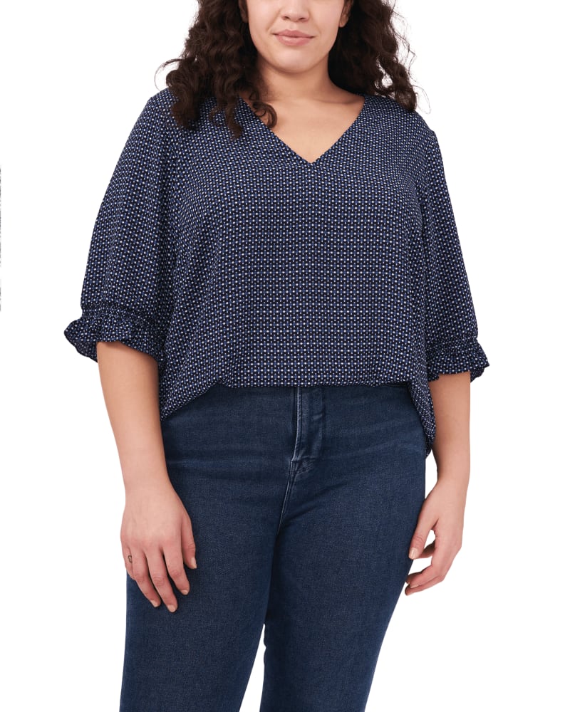 Front of a model wearing a size 1X Camilla V-Neck Blouse in GARDENGEOC by CeCe. | dia_product_style_image_id:263347